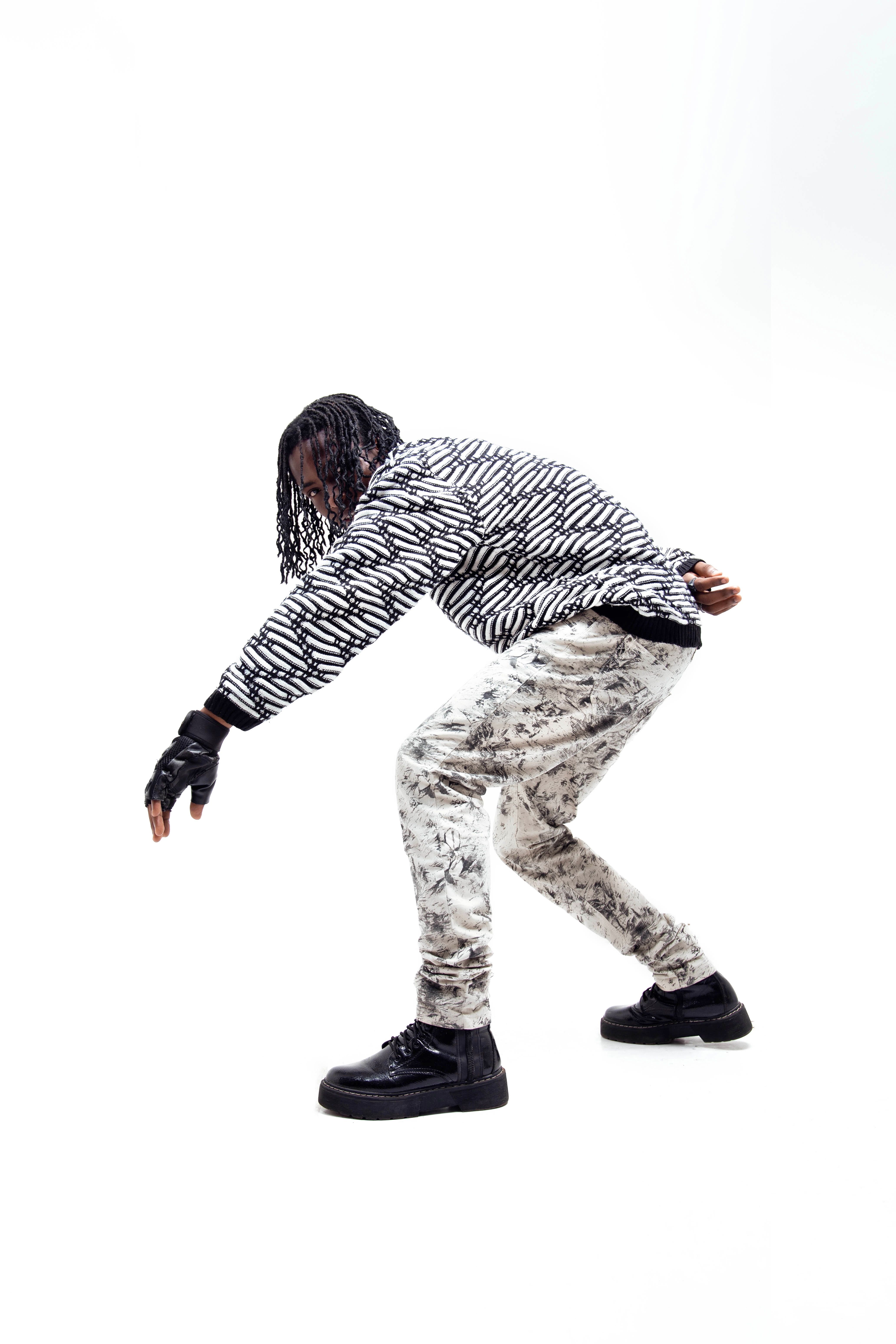 Man Posing in Sneaking Pose · Free Stock Photo