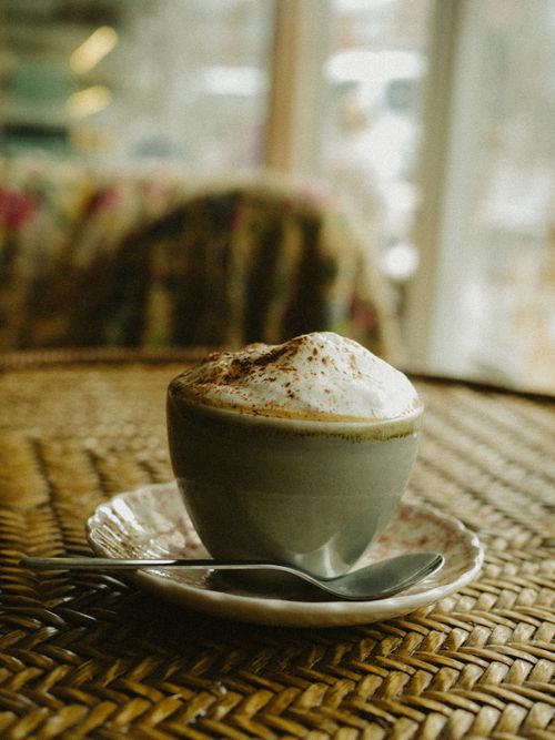 Free A warm cappuccino with frothy top on a wicker surface, indoors. Stock Photo