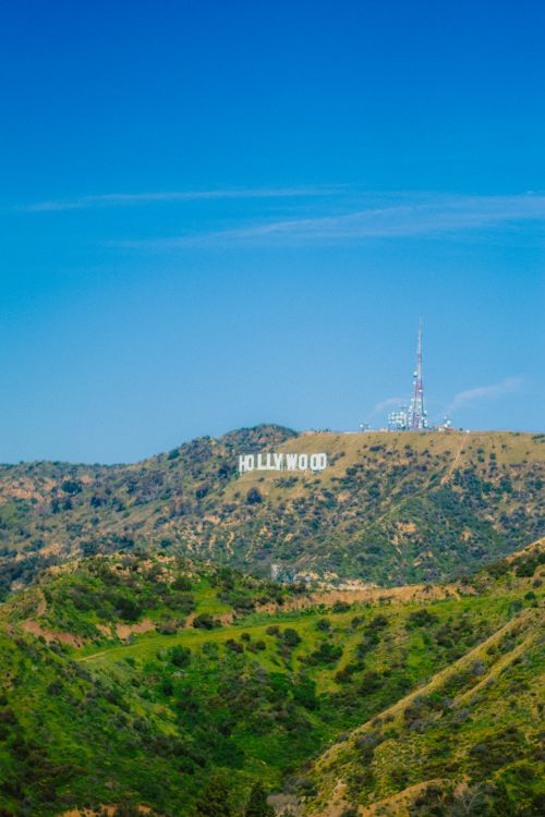 Free A vibrant view of the Hollywood Sign under a blue sky in Los Angeles, California. Stock Photo