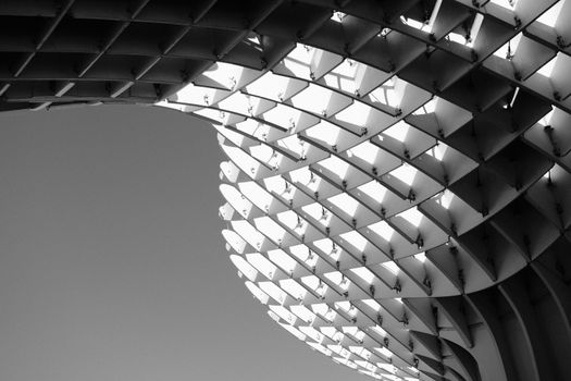 Black and white image showcasing the geometric structure of Metropol Parasol in Seville.