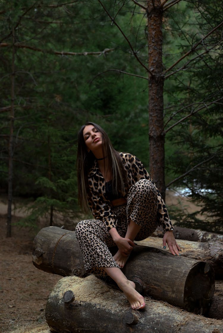 Model Posing In Leopard Print Pants