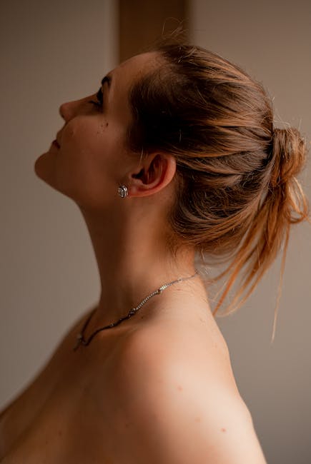 Elegant side profile of a woman with brown hair in an indoor setting, Brazil.