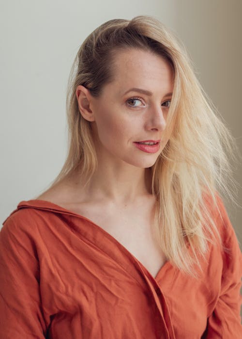 Young Blonde in an Orange Shirt 