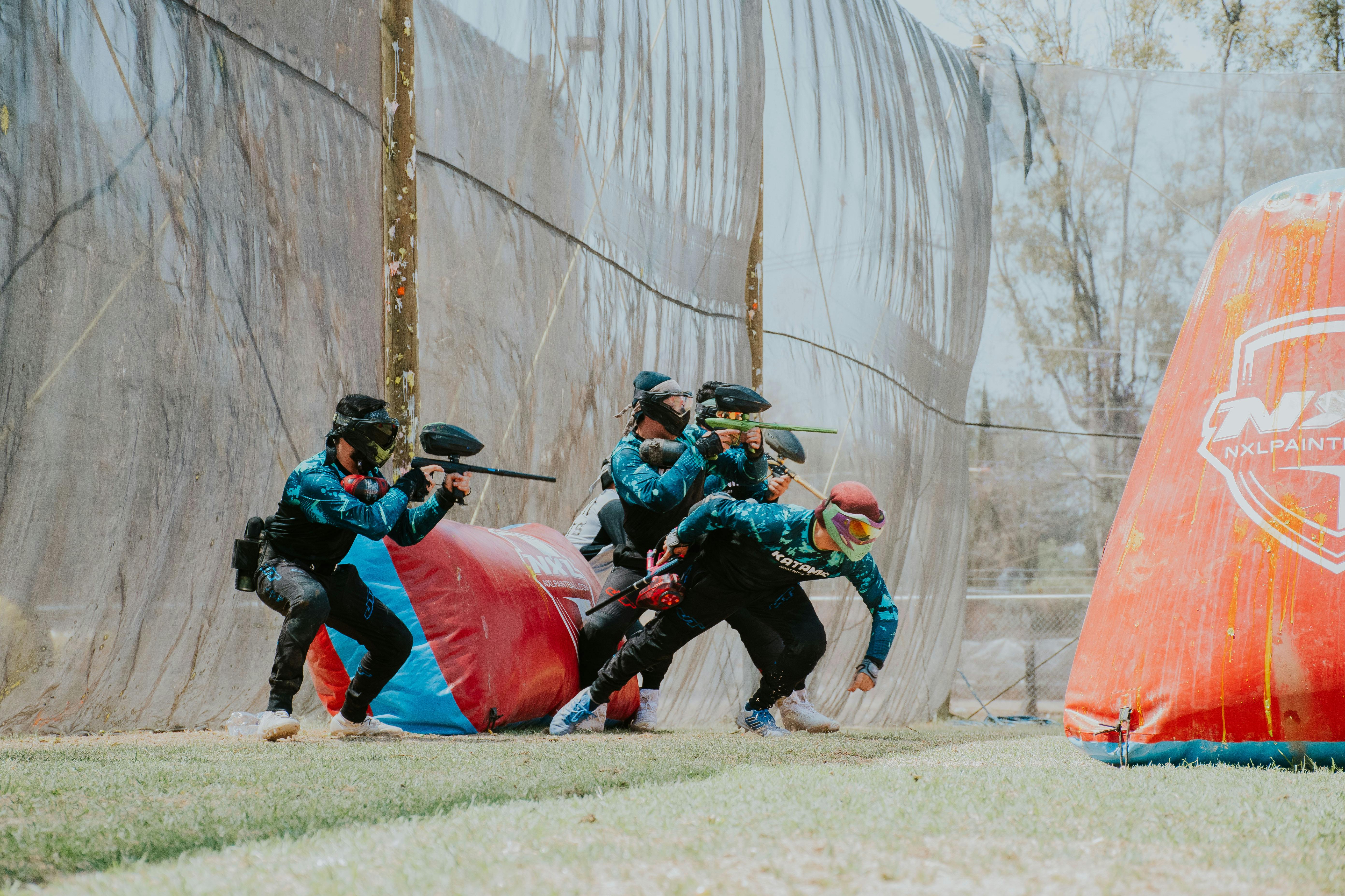 Exciting outdoor paintball game with players in action wearing gear and masks. Prescription Goggle Inserts - Exciting outdoor paintball game with players in action wearing gear and masks.