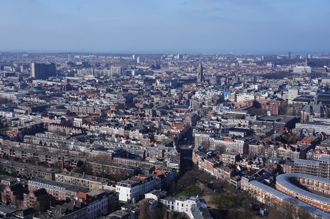 Aerial View of the City Under Blue and White Cloudy Sky