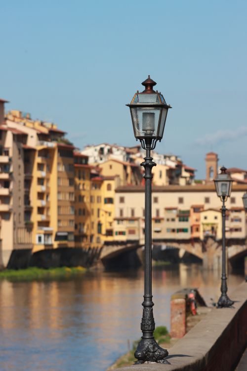 Free Street lamps with the historic Ponte Vecchio in the background, Florence, Italy. Stock Photo