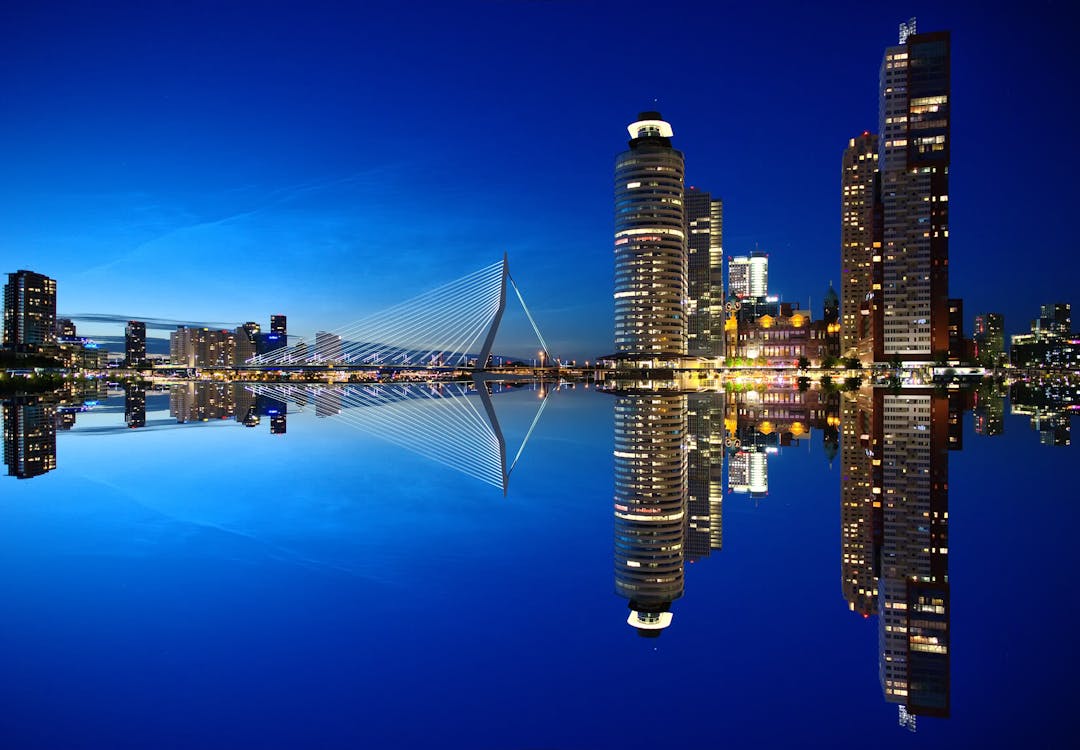 Mirrored Image of High Rise Buildings and Bridge