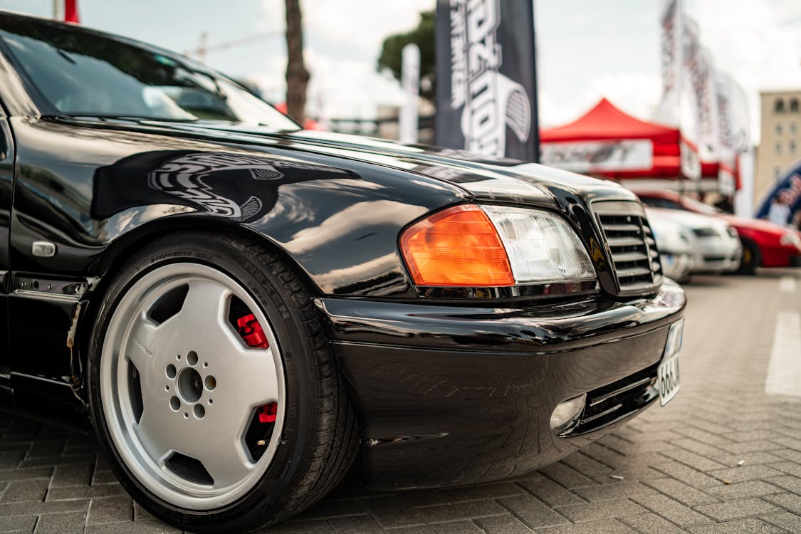Close-up of a Mercedes-Benz W202 at a Car Show · Free Stock Photo
