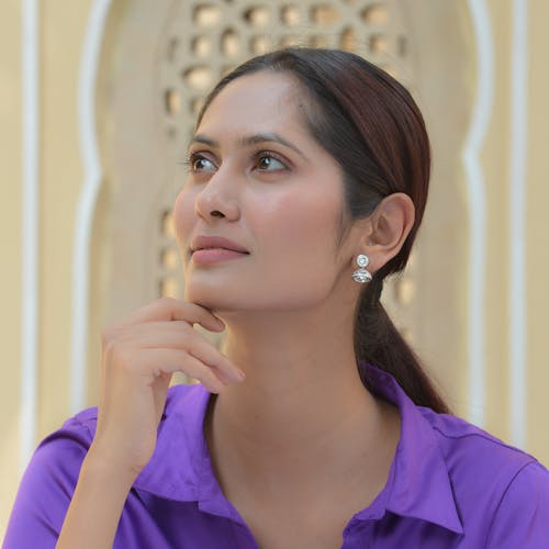 Portrait of an Elegant Brunette Wearing Silver Earrings 