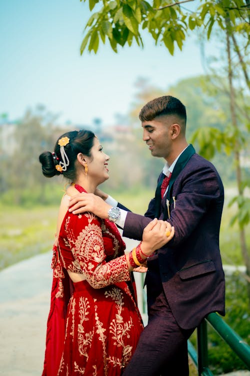 Man in Suit with Woman in Traditional Clothing