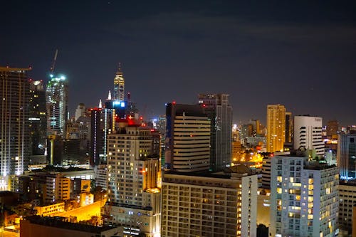 Concrete High Rise Building during Night Time