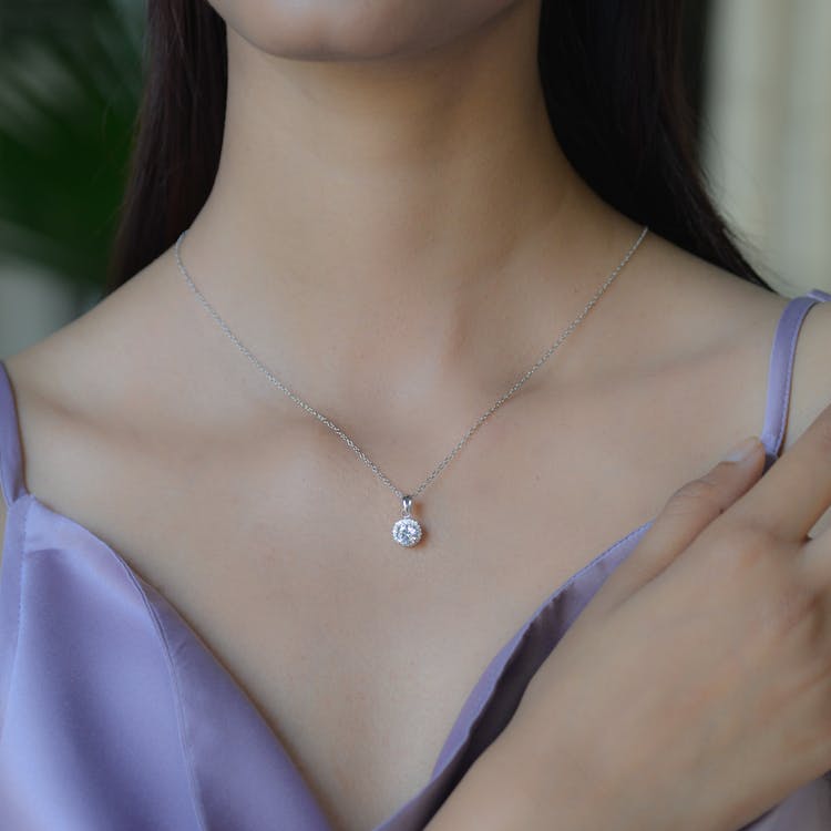 A Close-up Of A Necklace On Womans Neck