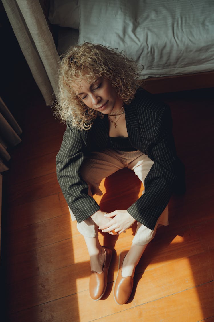 Young Fashionable Woman Sitting On The Floor