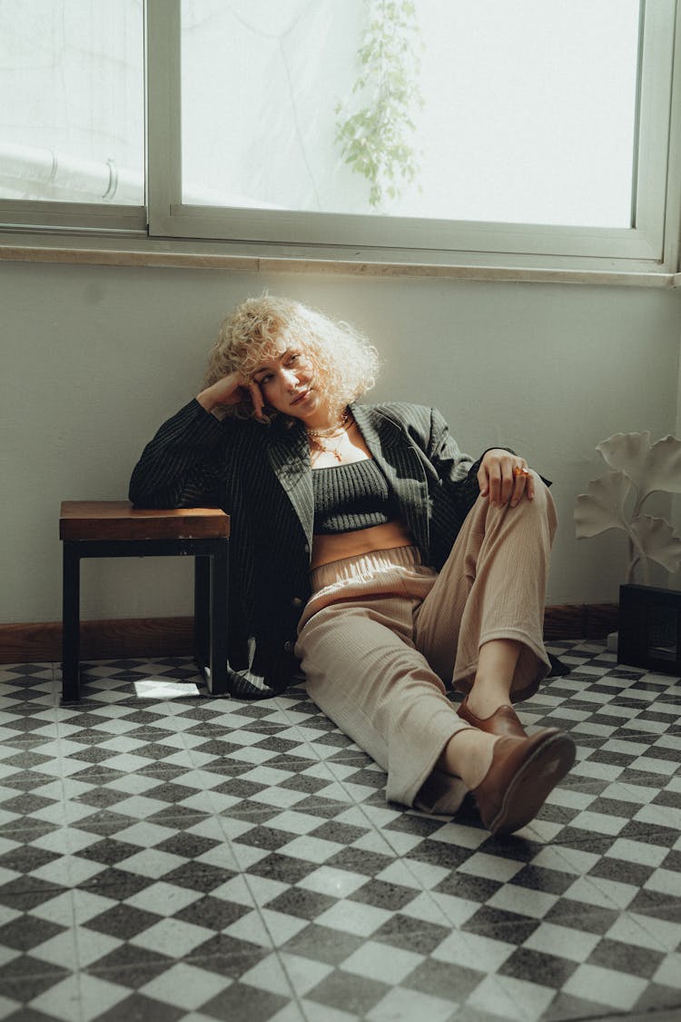 Young Fashionable Woman Sitting On The Floor