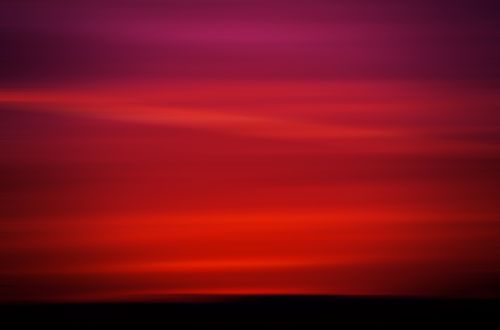 Free Stunning twilight sky with vibrant red and purple hues, creating a dramatic and serene atmosphere. Stock Photo