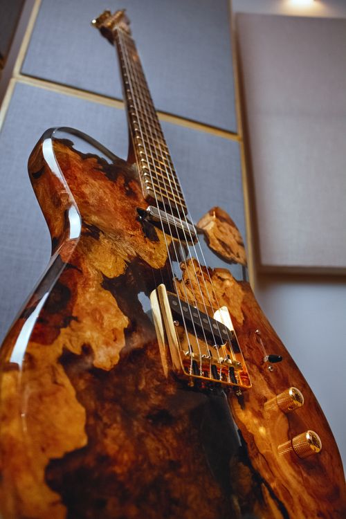 Free Close-up view of a beautifully designed custom electric guitar in a studio setting. Stock Photo