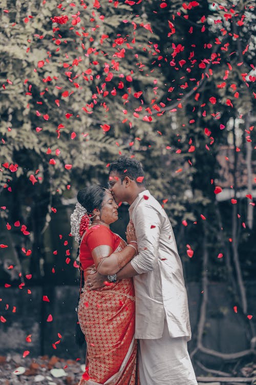 Kissing Newlyweds in Traditional Clothing