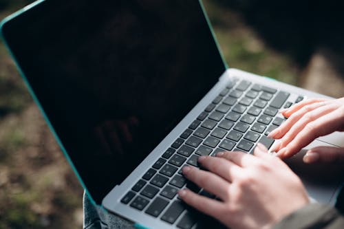 Hands on a Laptop 