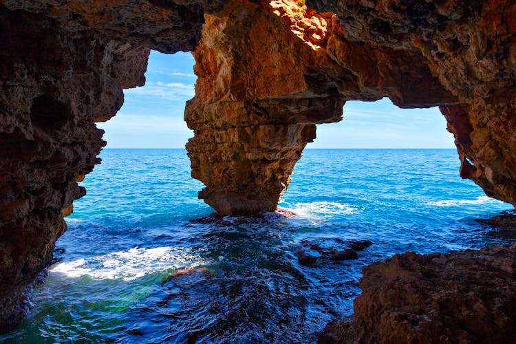 Cueva De Los Arcos In Cala Moraig, Alicante, Spain 