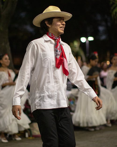 A Man in a Traditional Costume at the Festival