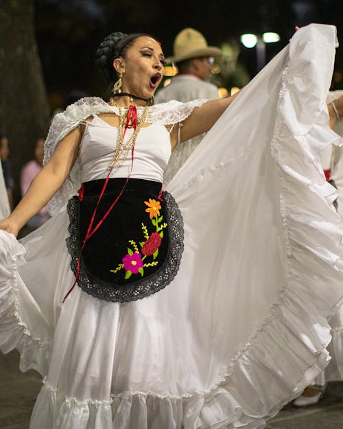 Woman in Traditional, White Dress on Ceremony