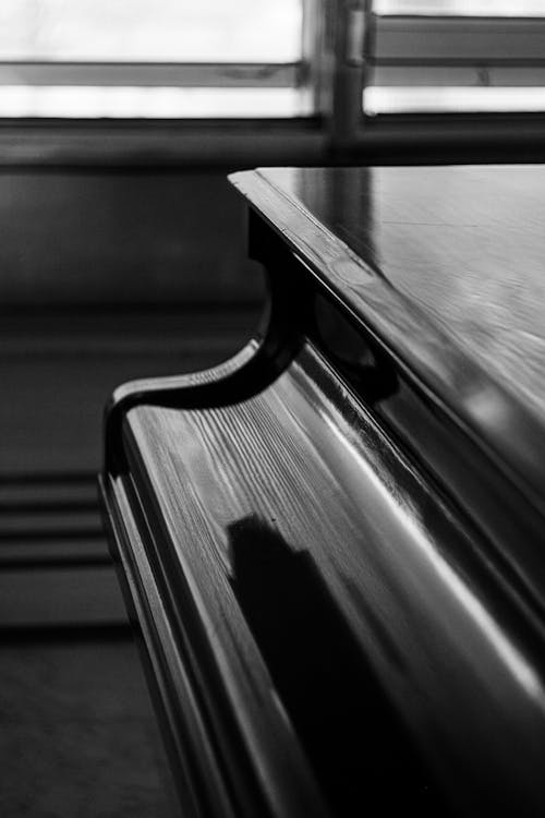 Black and White Picture of a Piano with a Closed Lid