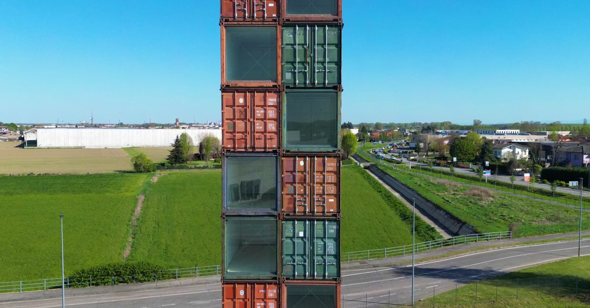 A tall tower made out of shipping containers · Free Stock Photo