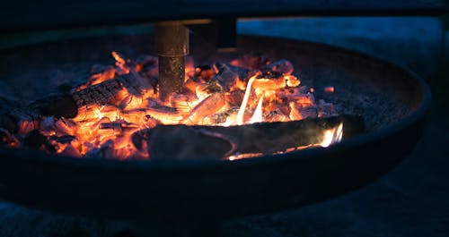 Round Fire Pit With Burning Wood