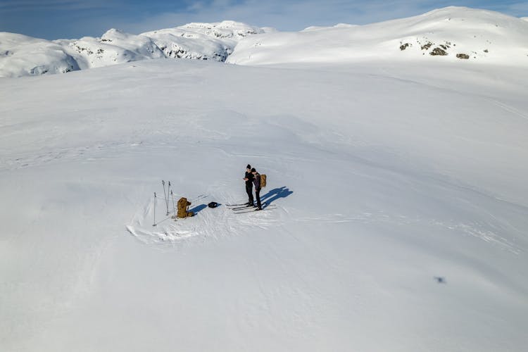 People Skiing In Mountains 