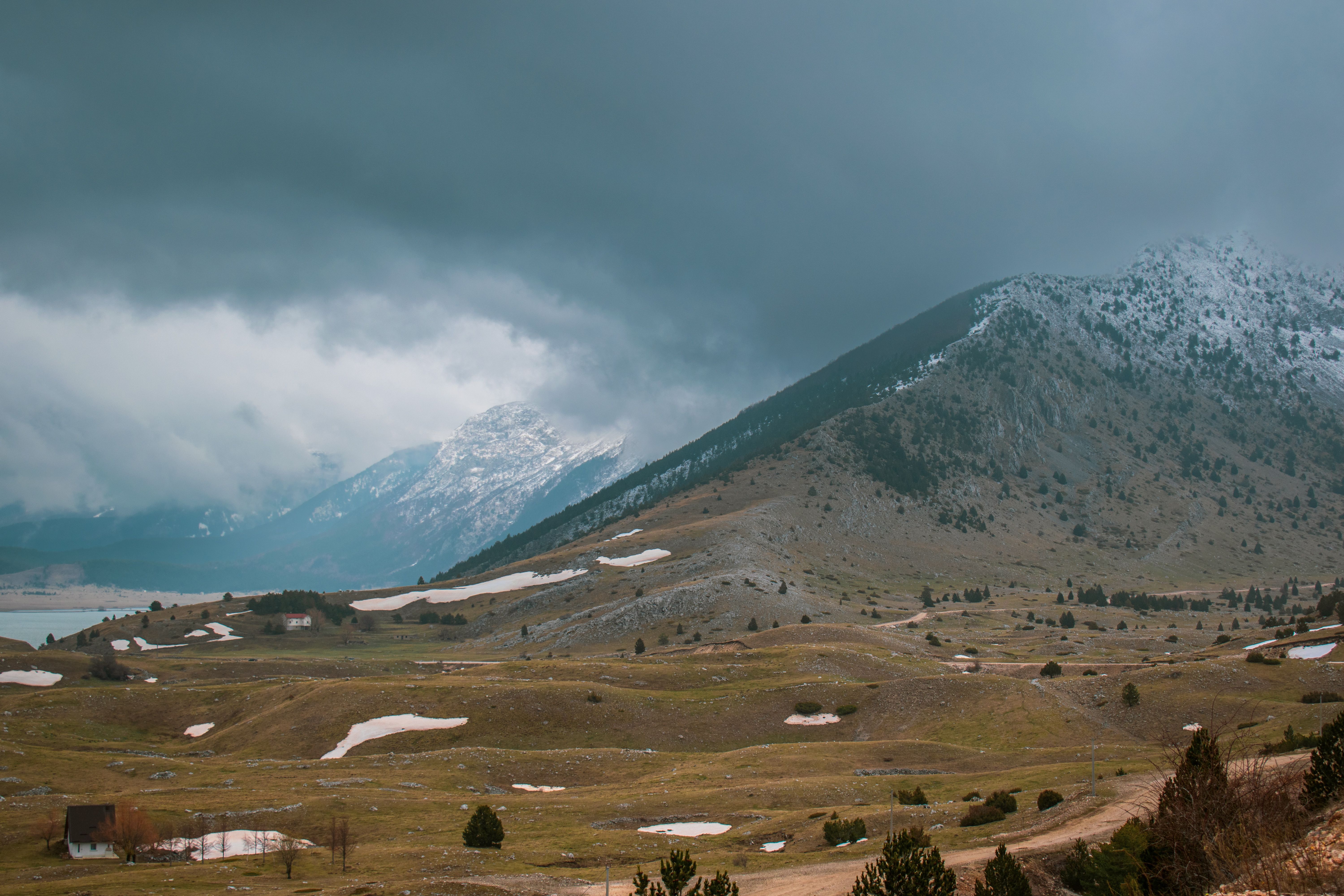 Traveler wearing layered clothing in the mountainous region of Bosnia and Herzegovina, suitable for changing weather.