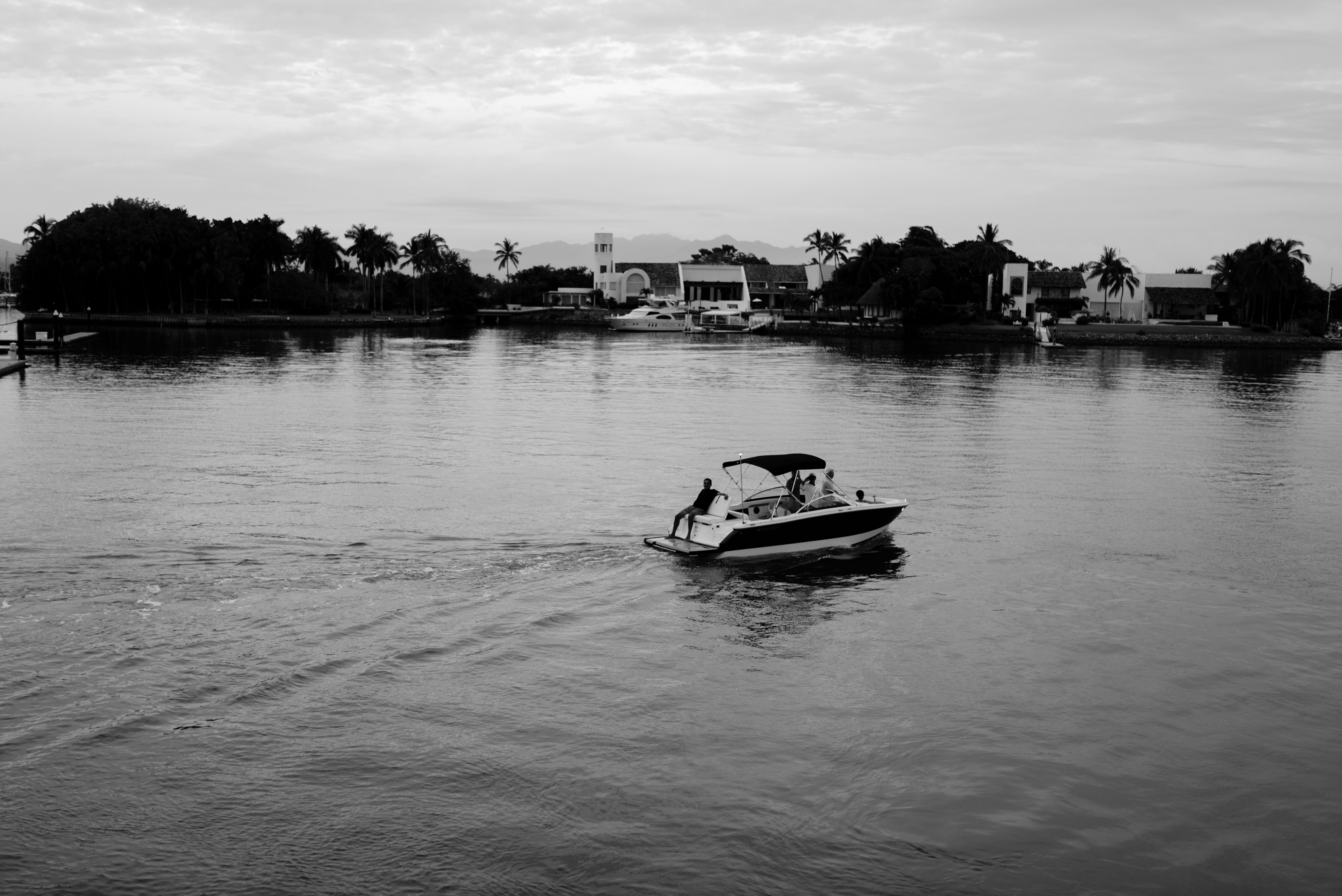 People on a Motorboat near the Shore · Free Stock Photo