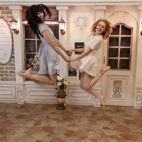 Free Photo of Two Women Jumping Stock Photo