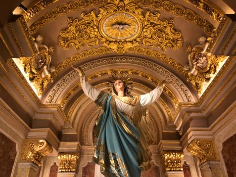 Ornate and detailed statue of Virgin Mary inside Gozo's Cathedral, showcasing religious artistry.