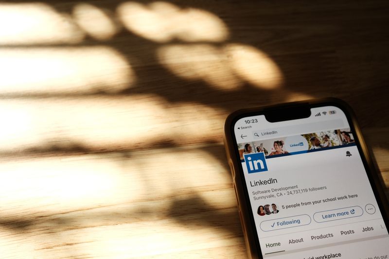 LinkedIn profile page showing blue circle profile picture on a smartphone mockup.