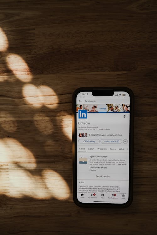 Free Linkedin Page on Cellphone Screen Stock Photo