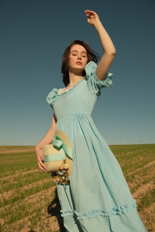 Model Posing in Dress in Field