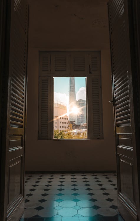 Free Gray Tower Through Window Stock Photo