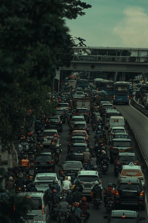 Free Chaotic traffic scene in Jakarta with cars and motorcycles during rush hour. Stock Photo