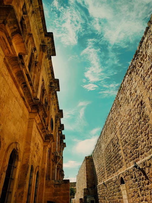 View of an Alley between Historical Buildings in an Old Town 