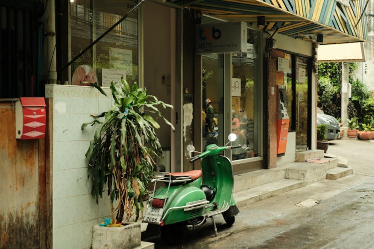 Vintage Scooter Parked By Store