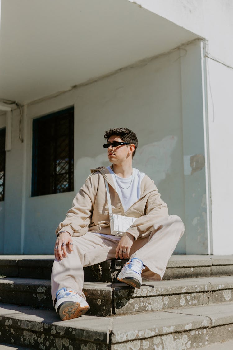 Fashionable Young Man Sitting On Steps