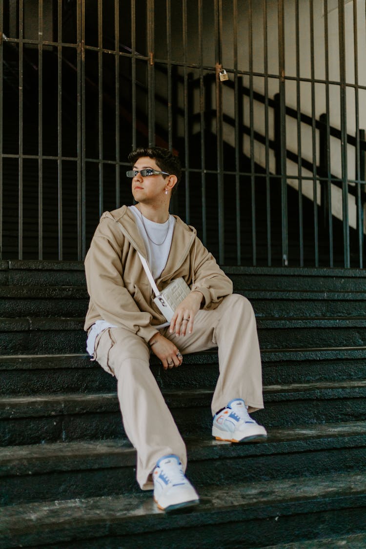 Fashionable Young Man Sitting On Steps