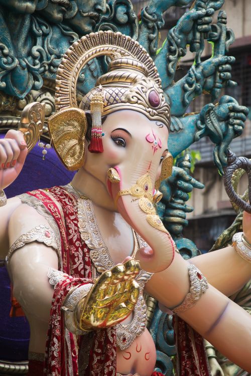 Free Detailed image of a vibrant Ganesh idol decorated for Ganesh Chaturthi in Mumbai, India. Stock Photo