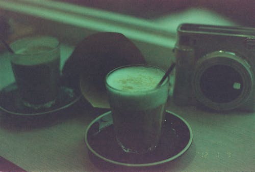 Coffee in Glasses and Camera on Table