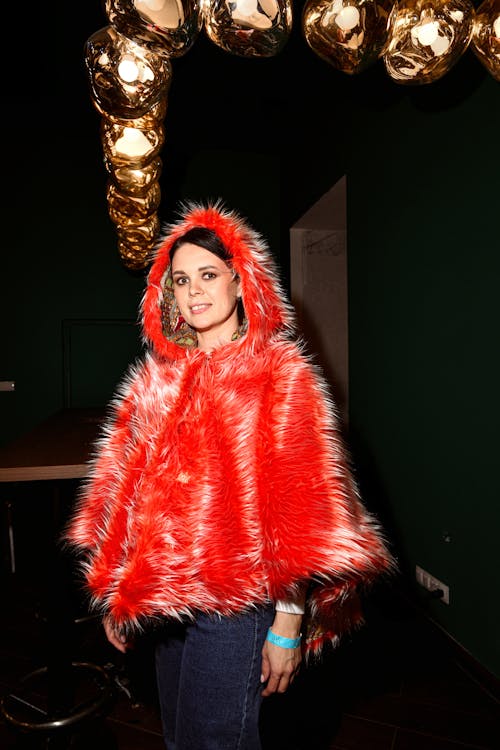 Woman Posing in Red Coat