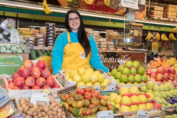 Smiling Woman Working In Grocery Store