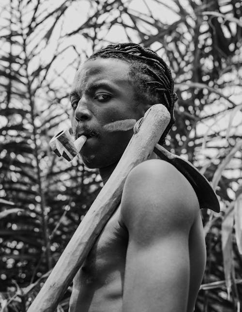 Portrait of Man with Tribal Pipe in Black and White