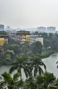 Aerial view of Dhaka's urban landscape during a tropical rain shower.