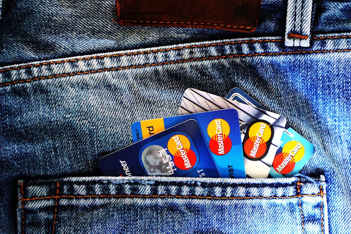 Free Blue Master Card on Denim Pocket Stock Photo