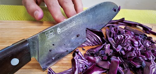 Close-up of a Person Slicing Red Cabbage 